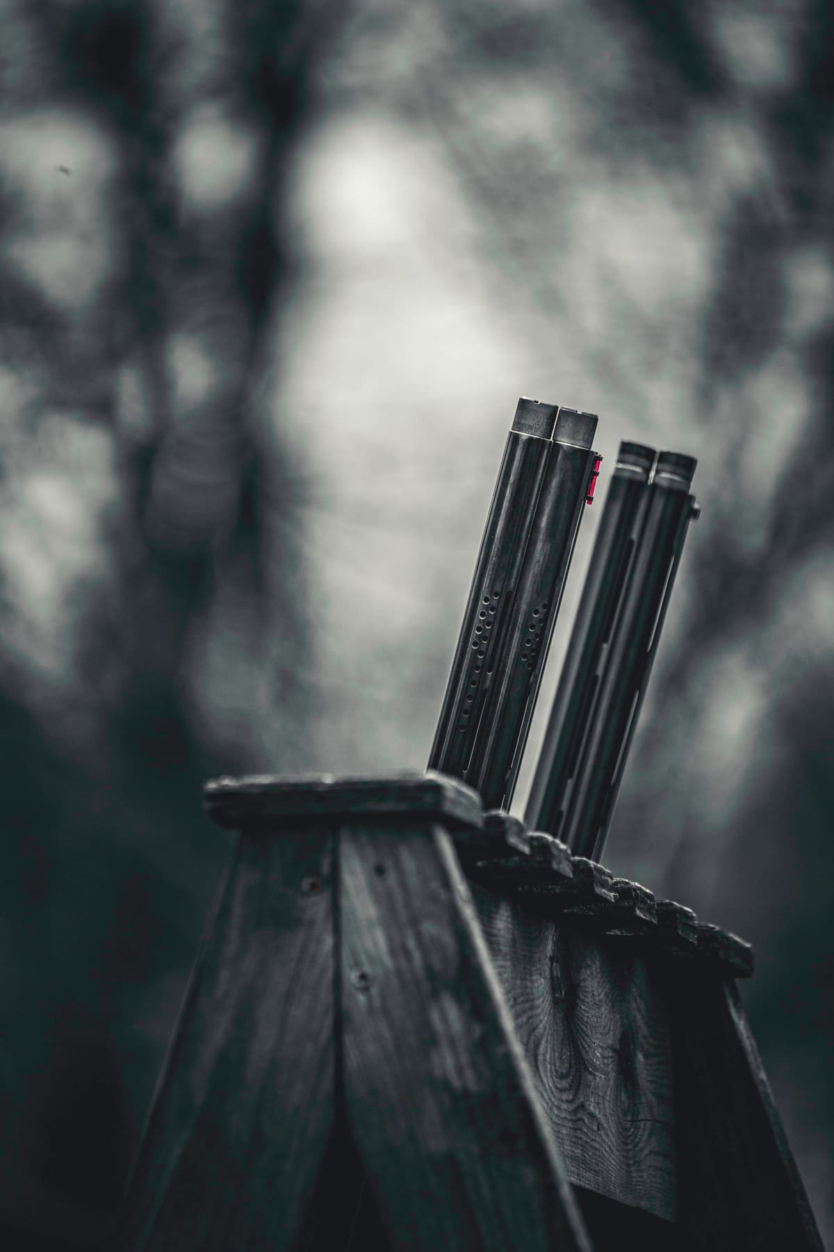 A close detail of dark barrels and weathered wood.